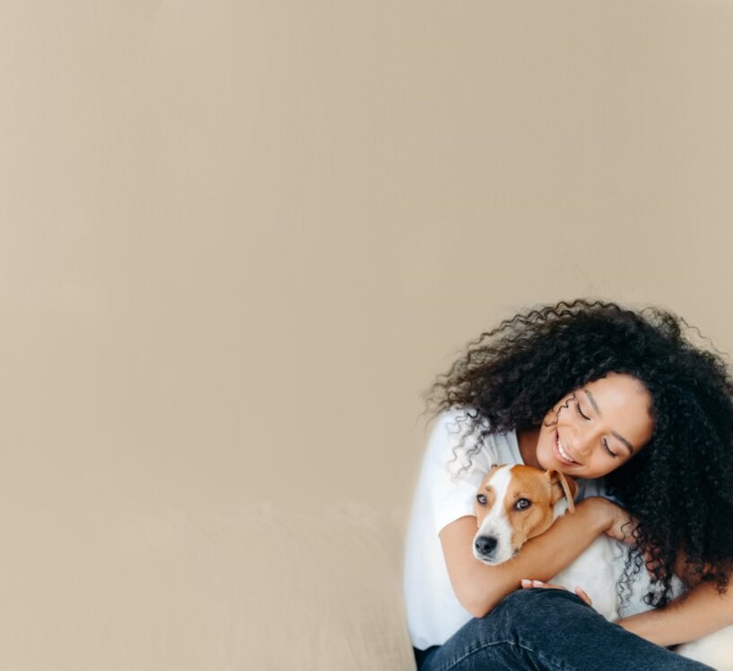 Woman holding her dog